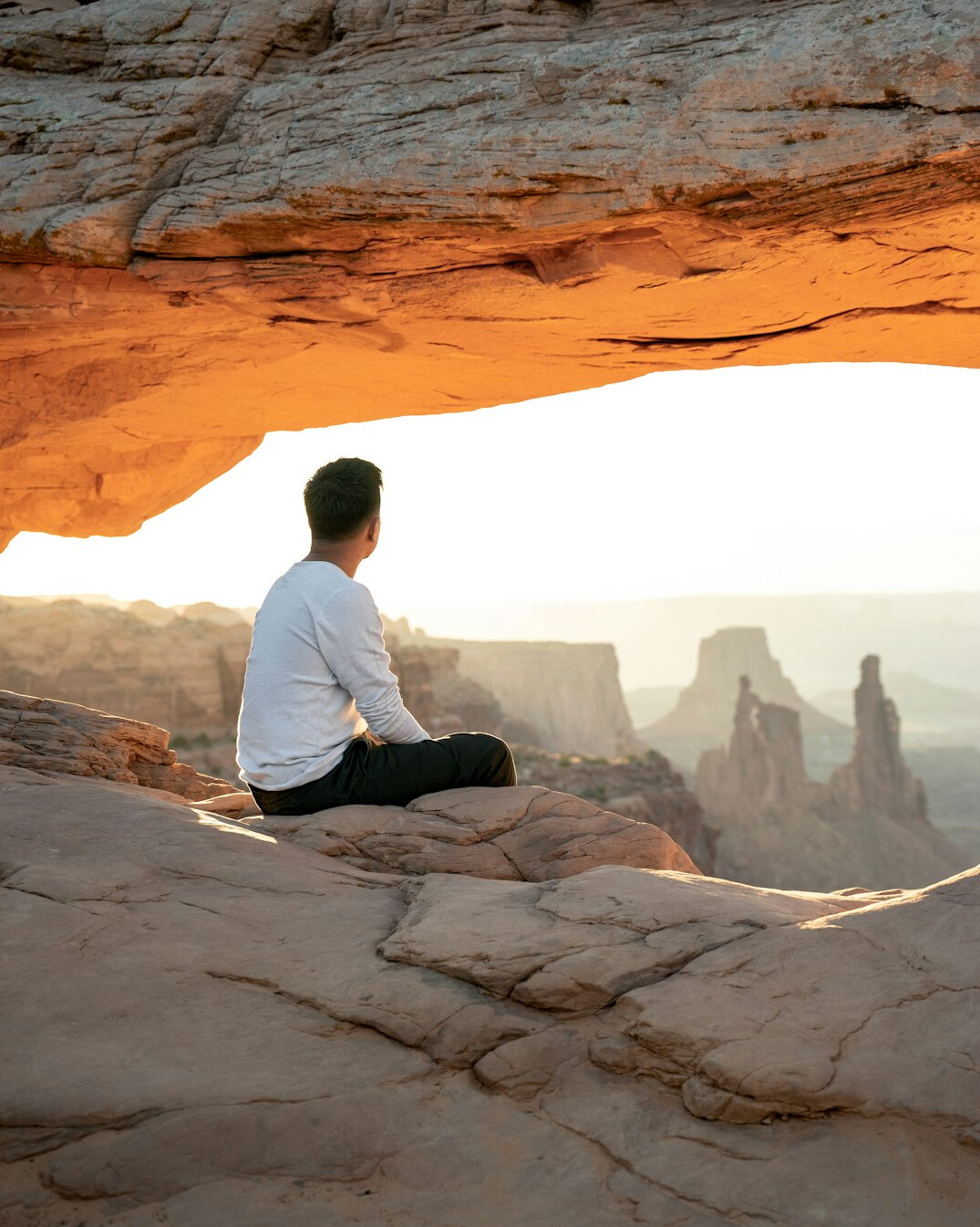 person meditating at sunrise